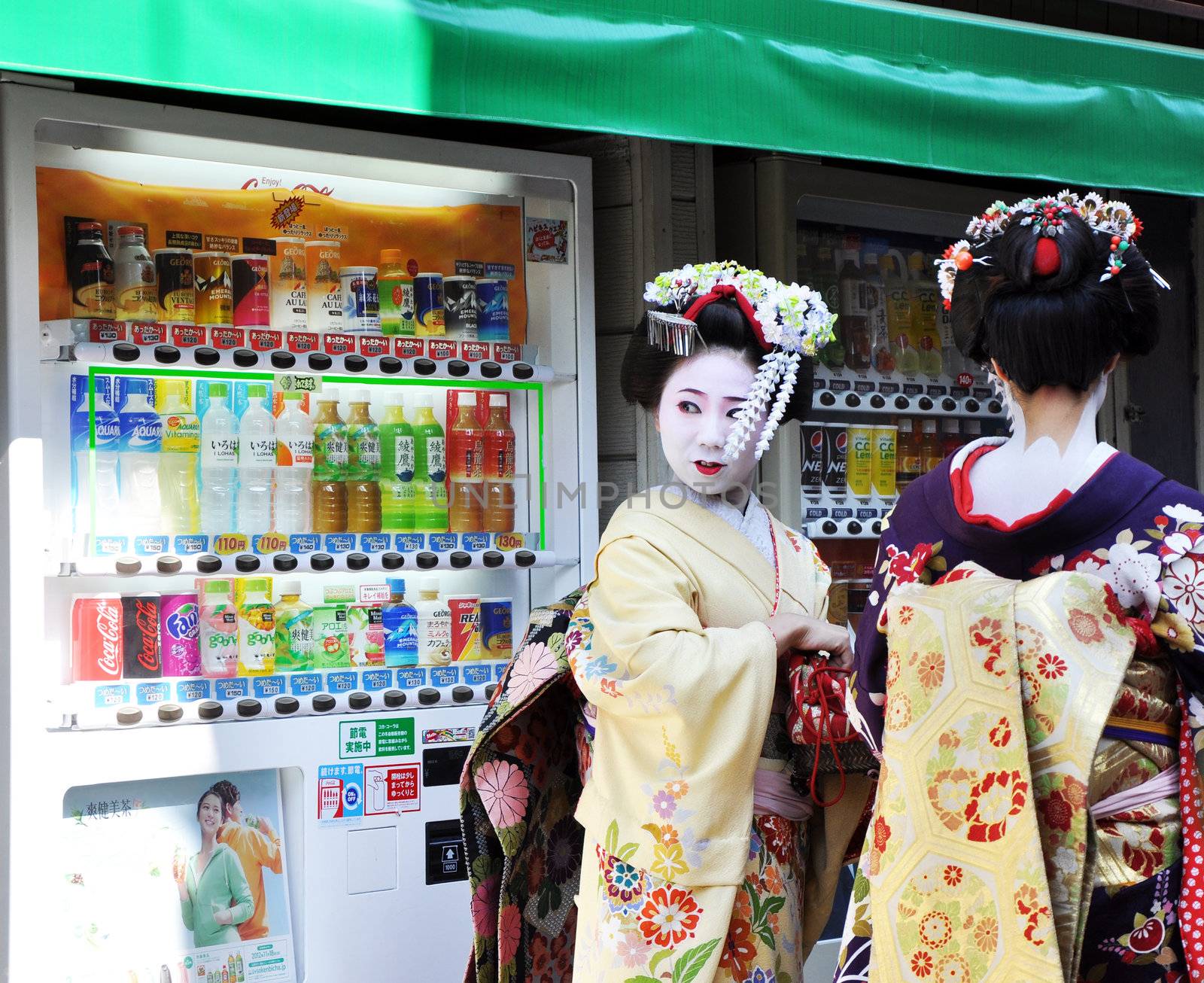 KYOTO, JAPAN - OCT 21 2012: Japanese ladies in traditional dress  on a street leading to Kiyomizu Temple on October 21 2012. Kiyomizu is a famous temple in Kyoto built in year 778.
