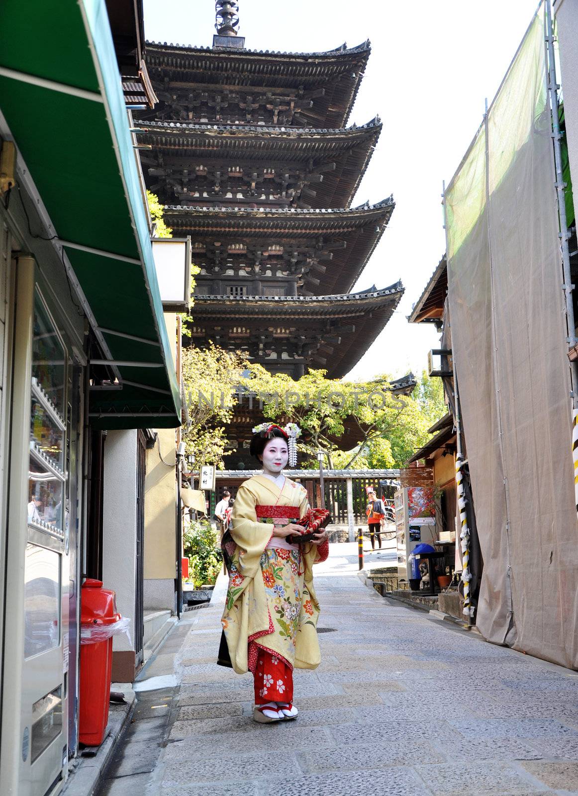 KYOTO, JAPAN - OCT 21 2012: Japanese ladies in traditional dress by siraanamwong