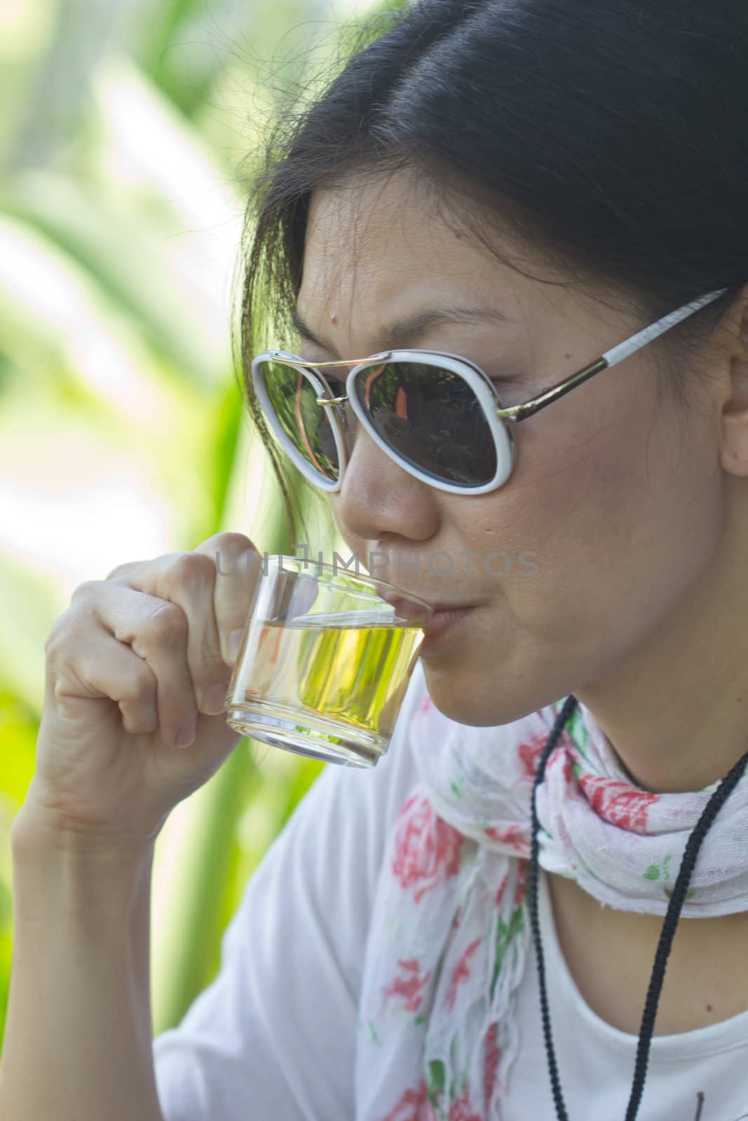 Beautiful young woman drinking tea in the afternoon