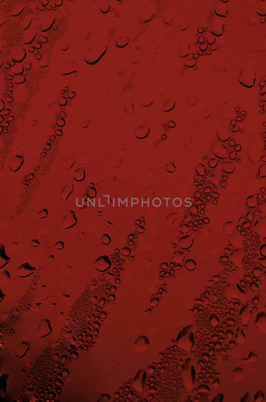 Background with water drops in red color