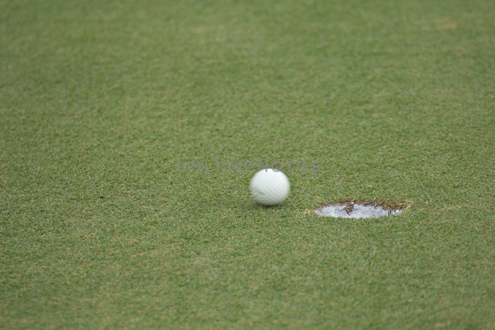 Golf ball very close to the hole