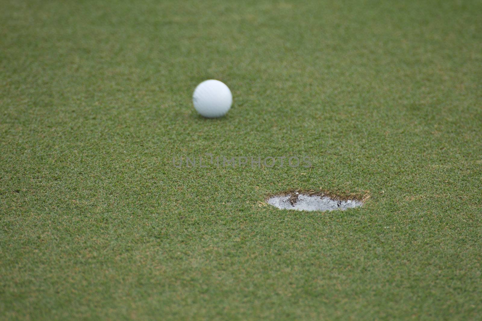 Golf ball very close to the hole
