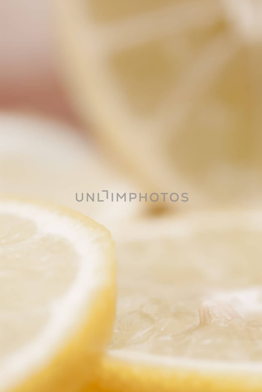 Cross section of sliced lemon on chopping board.