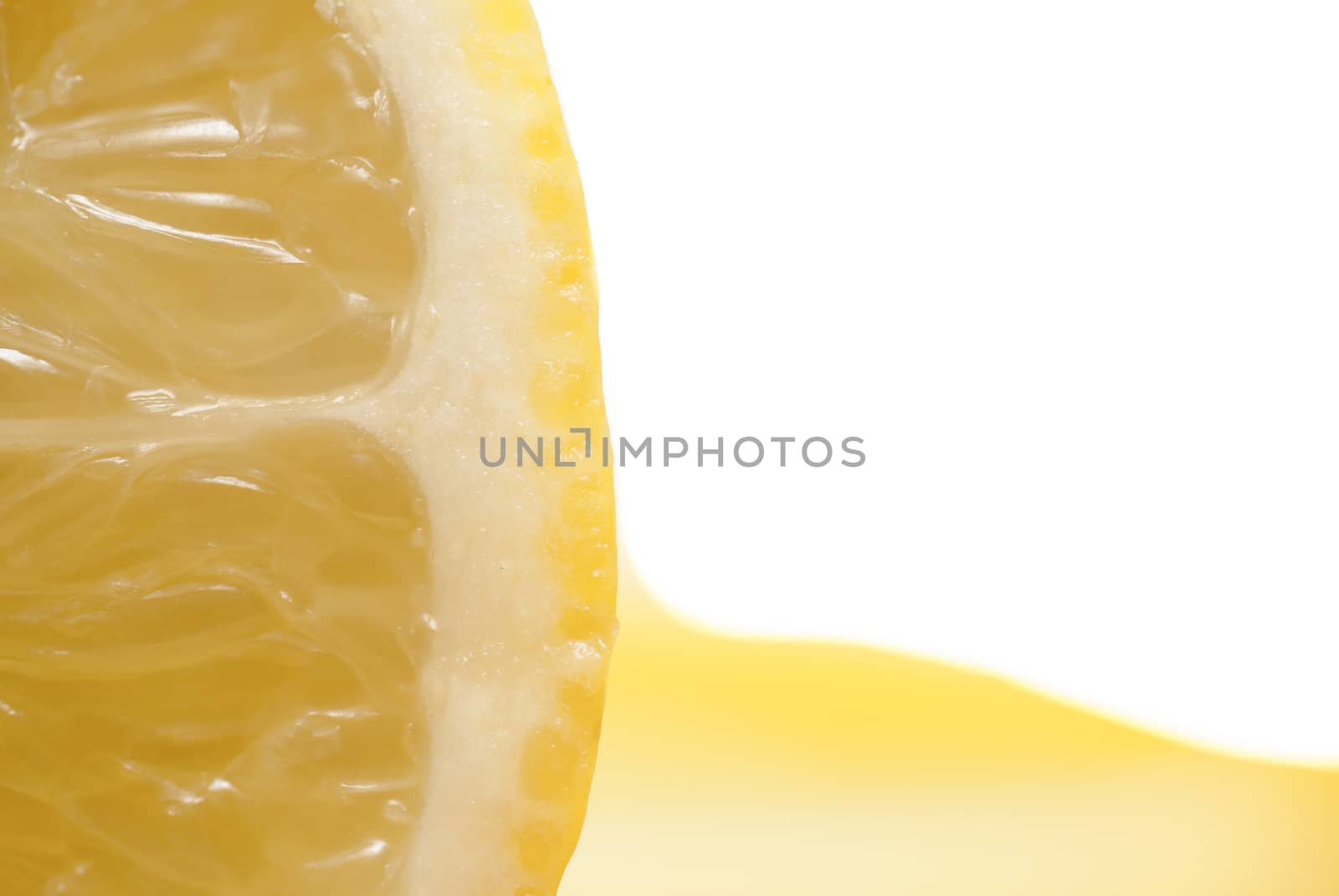 Cross section of sliced lemon in a glass.