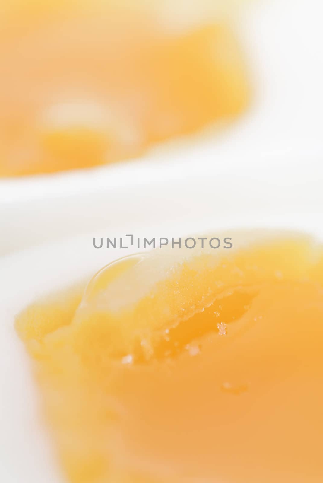 Macro photo of two halves of a boiled egg.