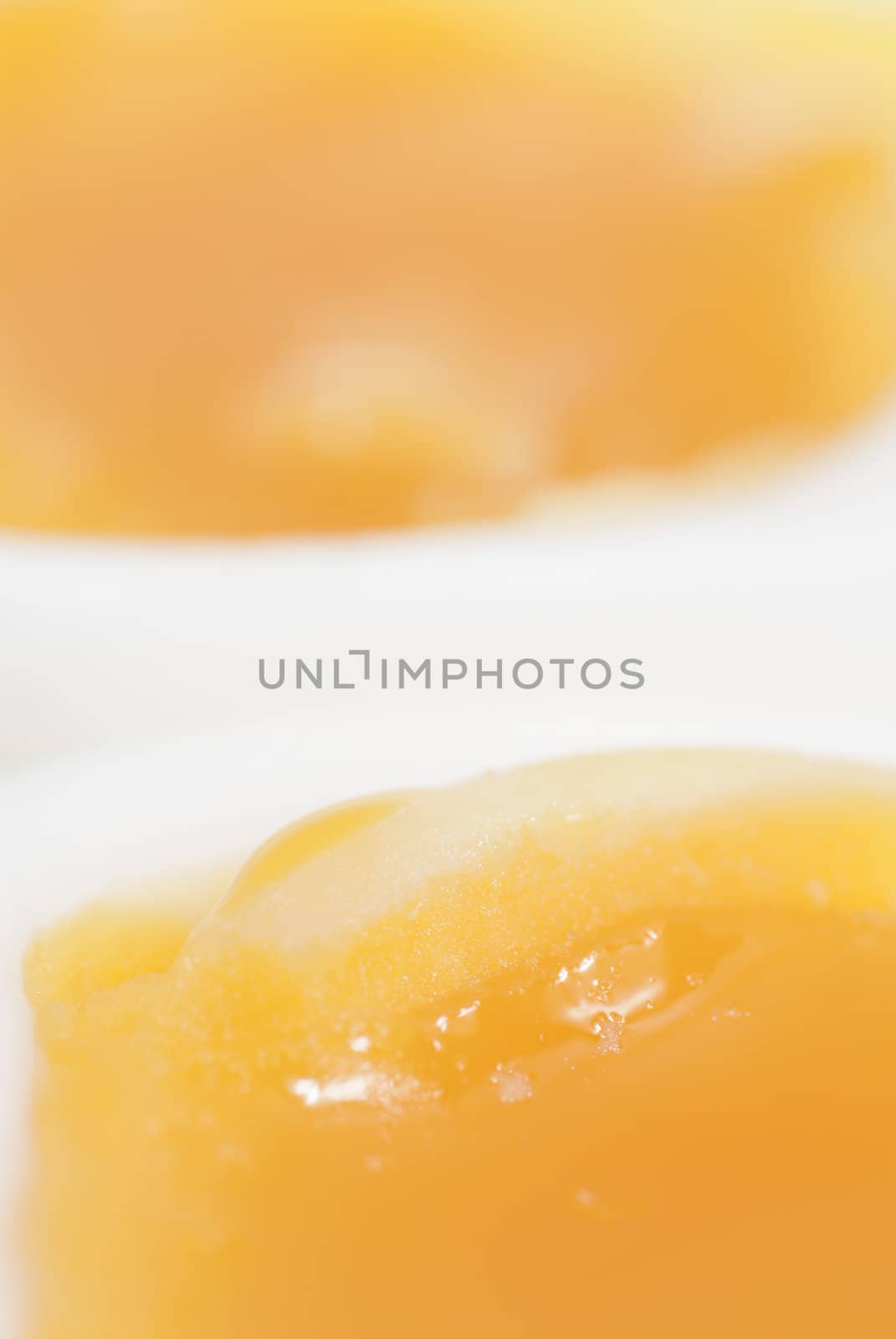 Macro photo of two halves of a boiled egg.