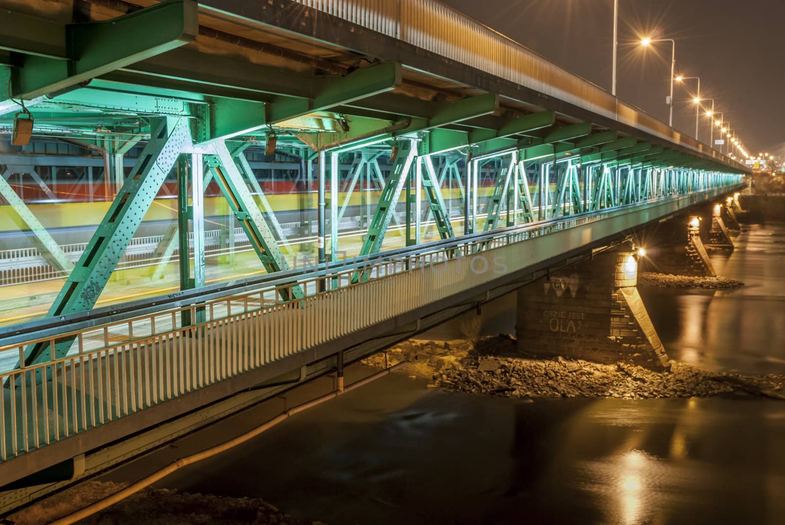 Gdanski bridge at night across Warsaw's Wisla river.