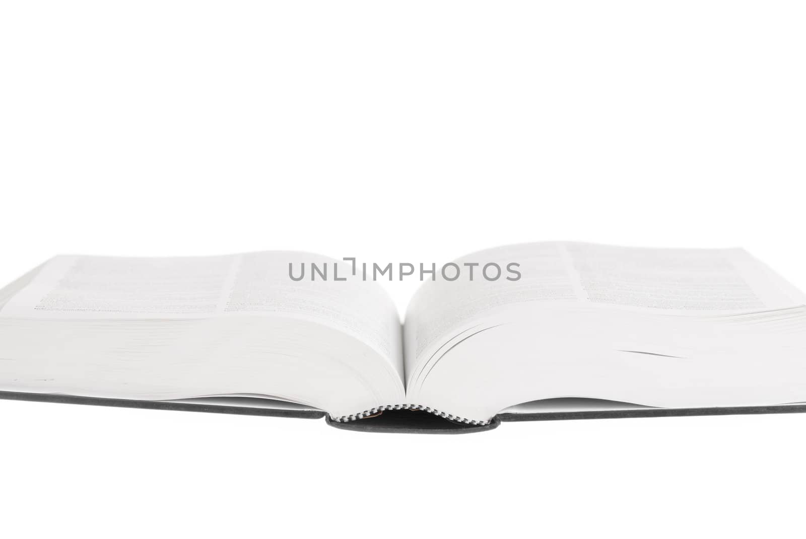 Large book open against white background.