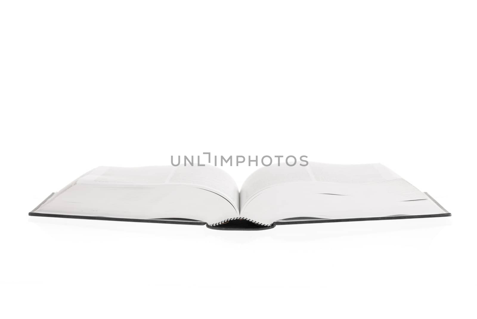 Large book open against white background.