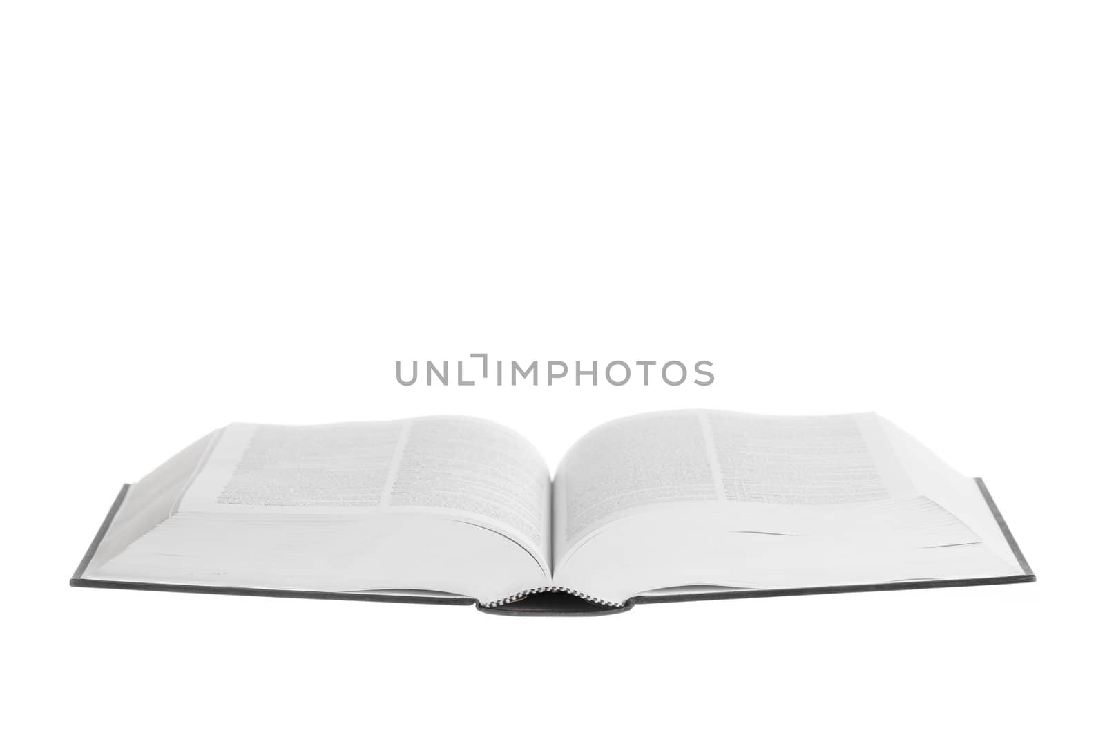 Large book open against white background.