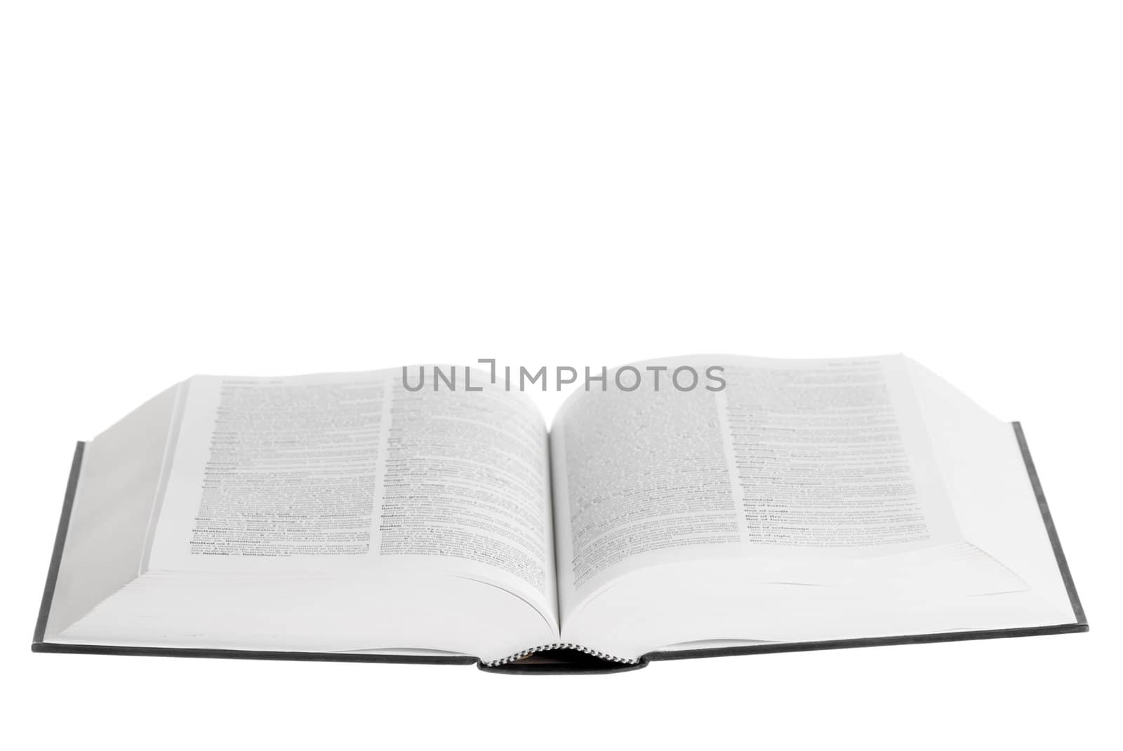 Large book open against white background.