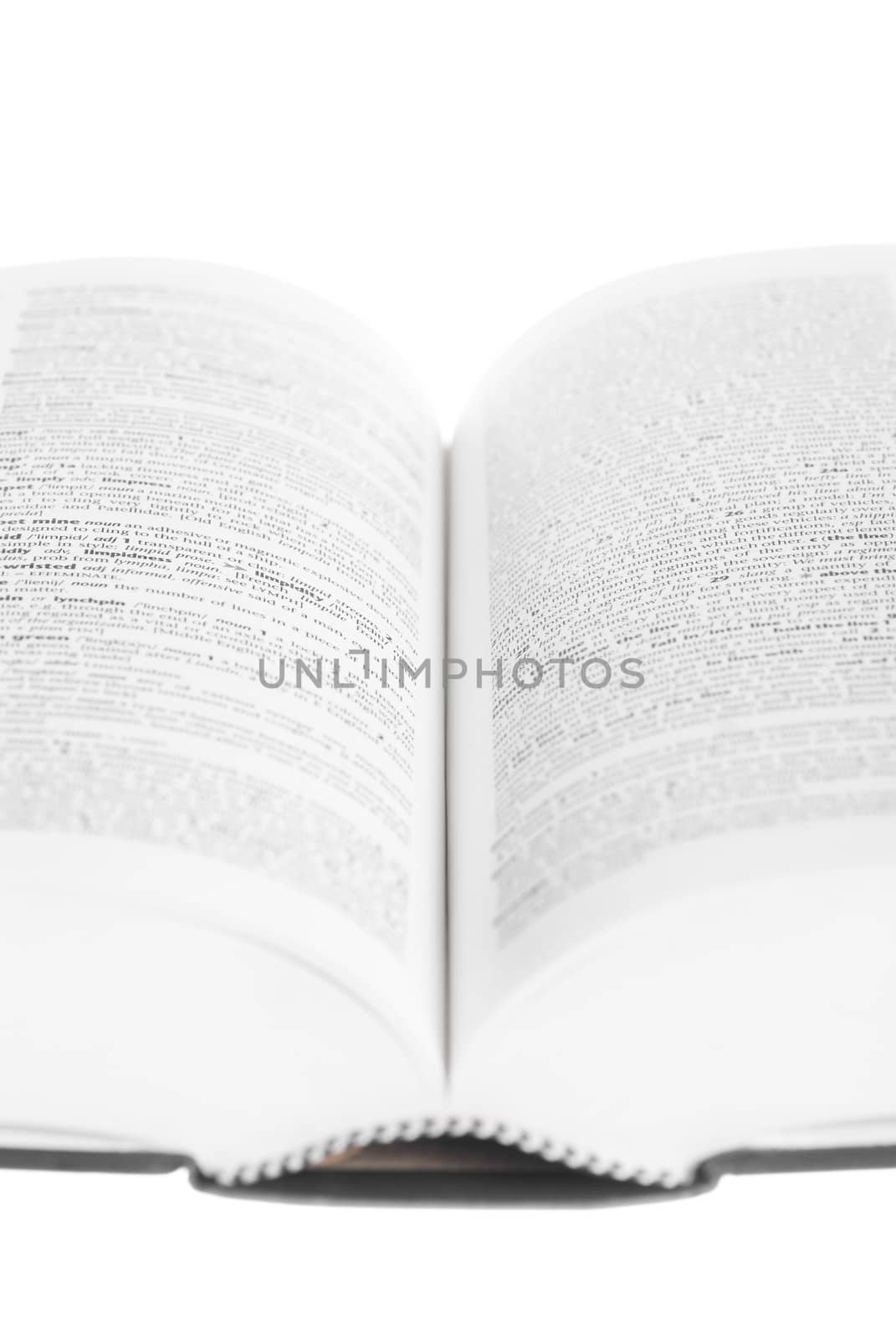 Large book open against white background.