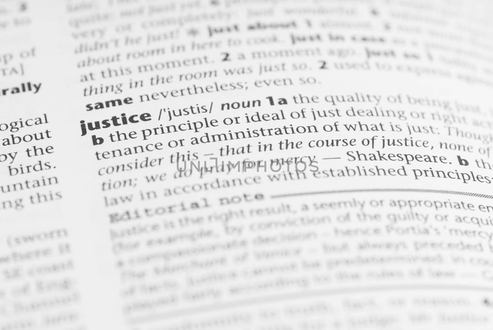 Macro image of dictionary word: Justice.