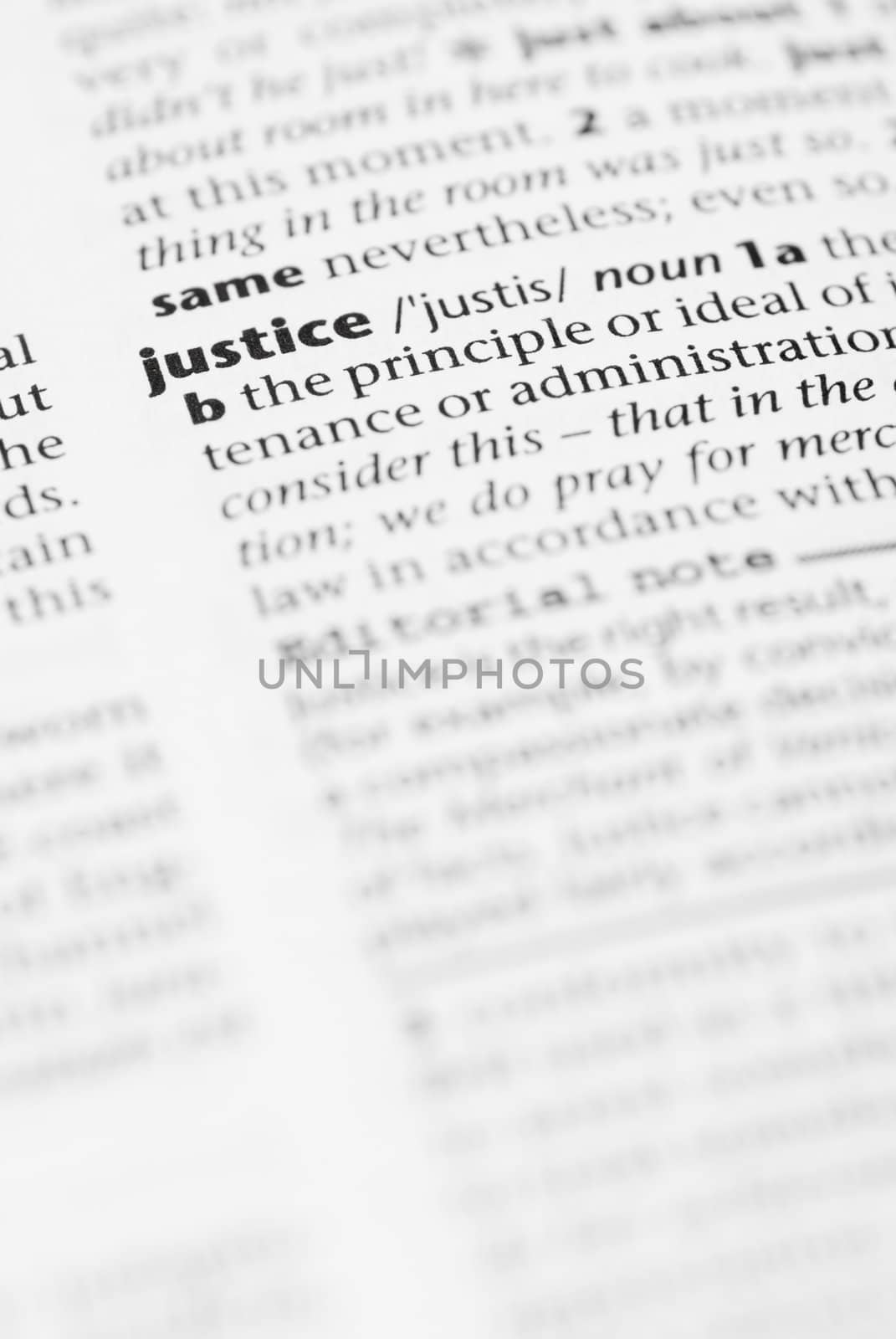 Macro image of dictionary word: Justice.