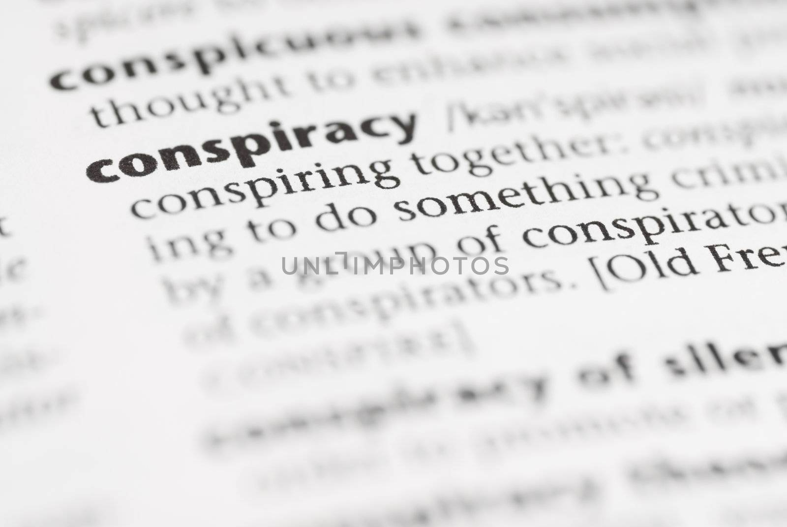 Macro image of dictionary word: Conspiracy.