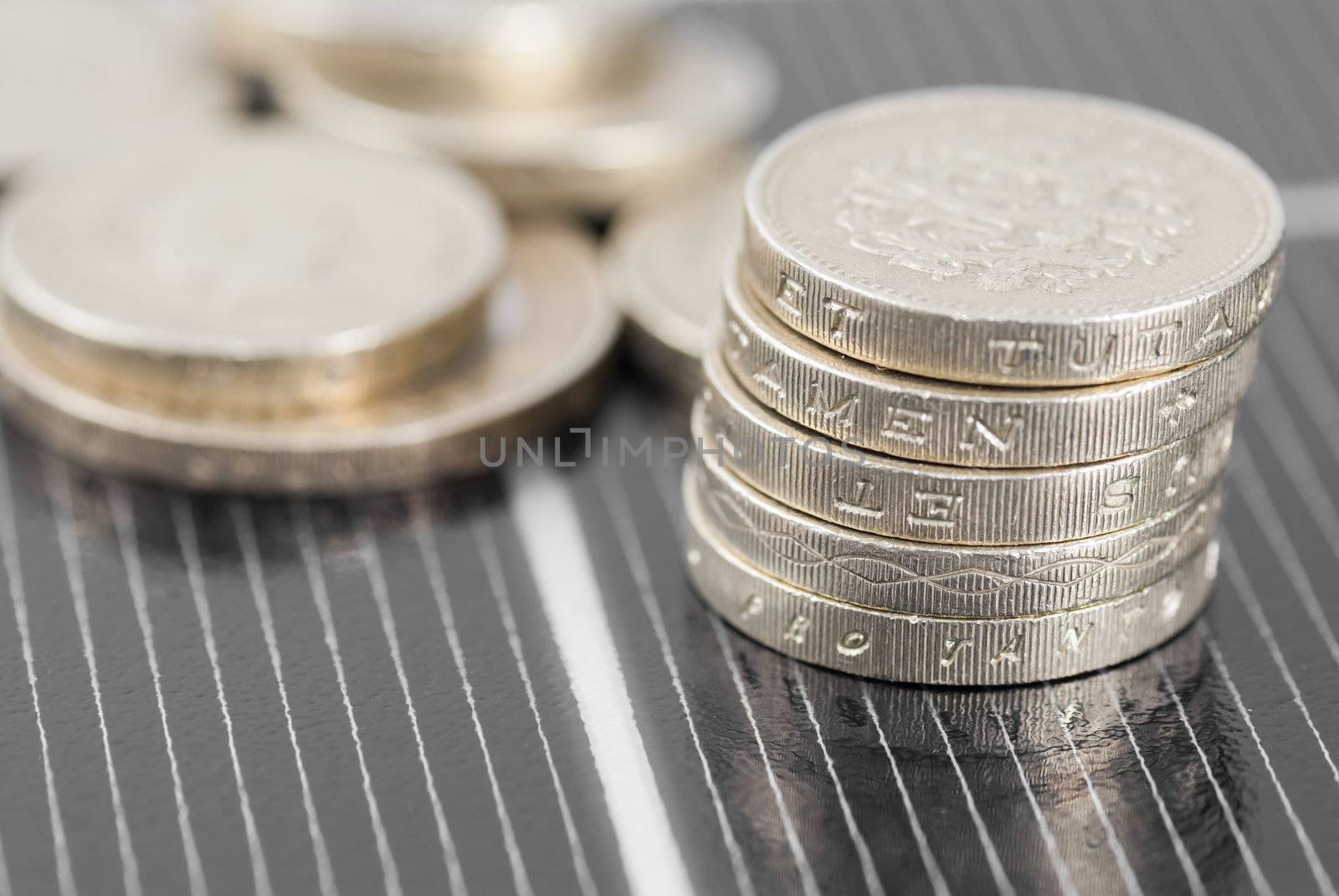 Macro image of Photovoltaic solar panel. Money ££'s.