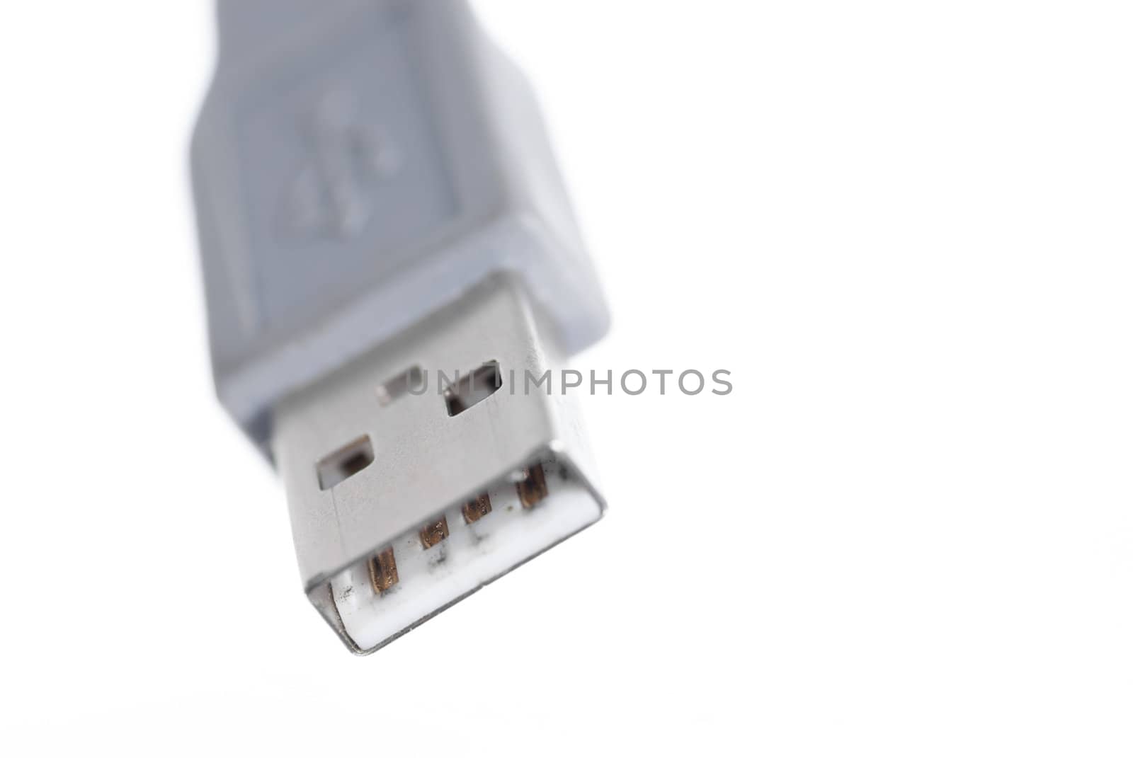 Macro image of one USB connector on white background.