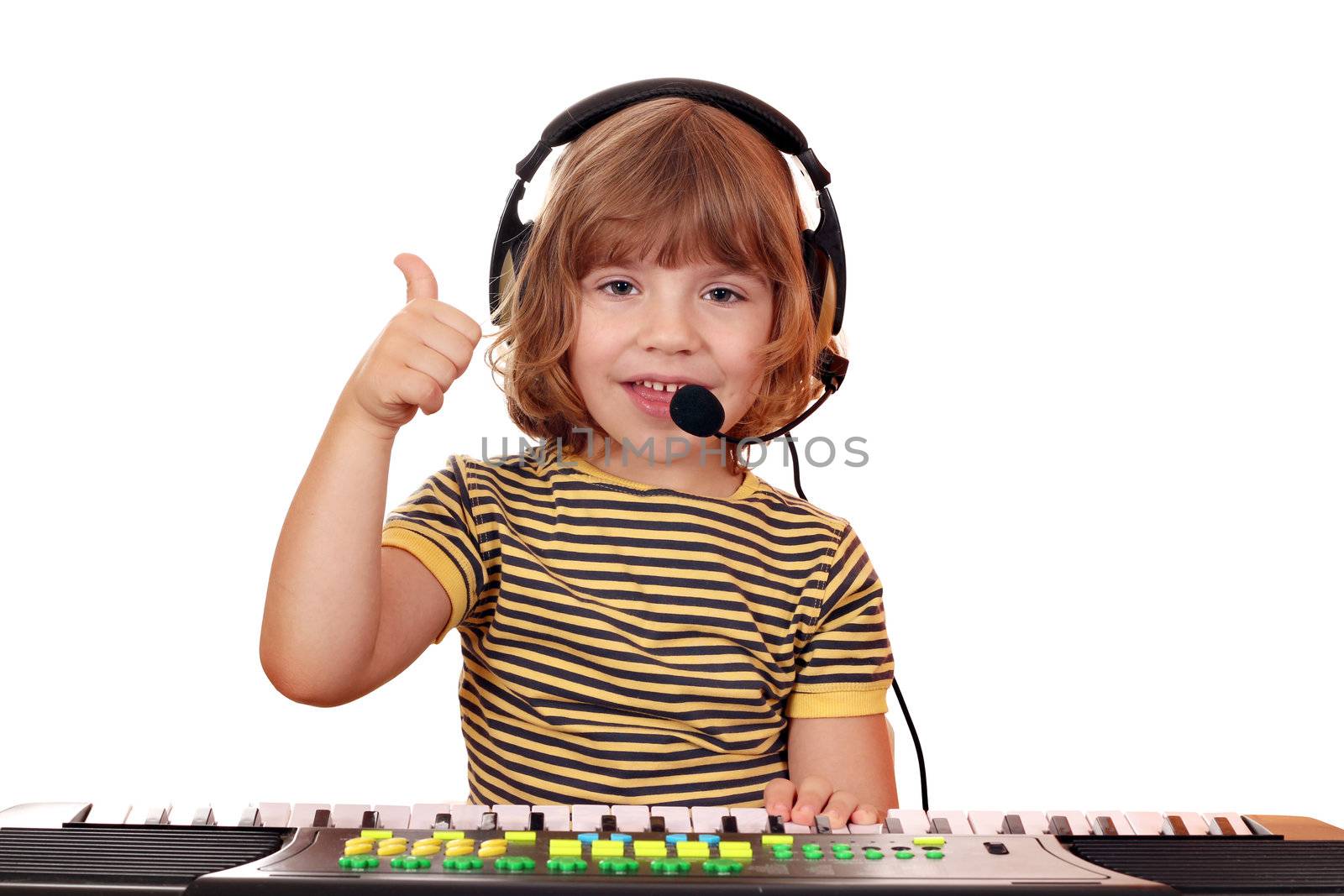 happy little girl play keyboard