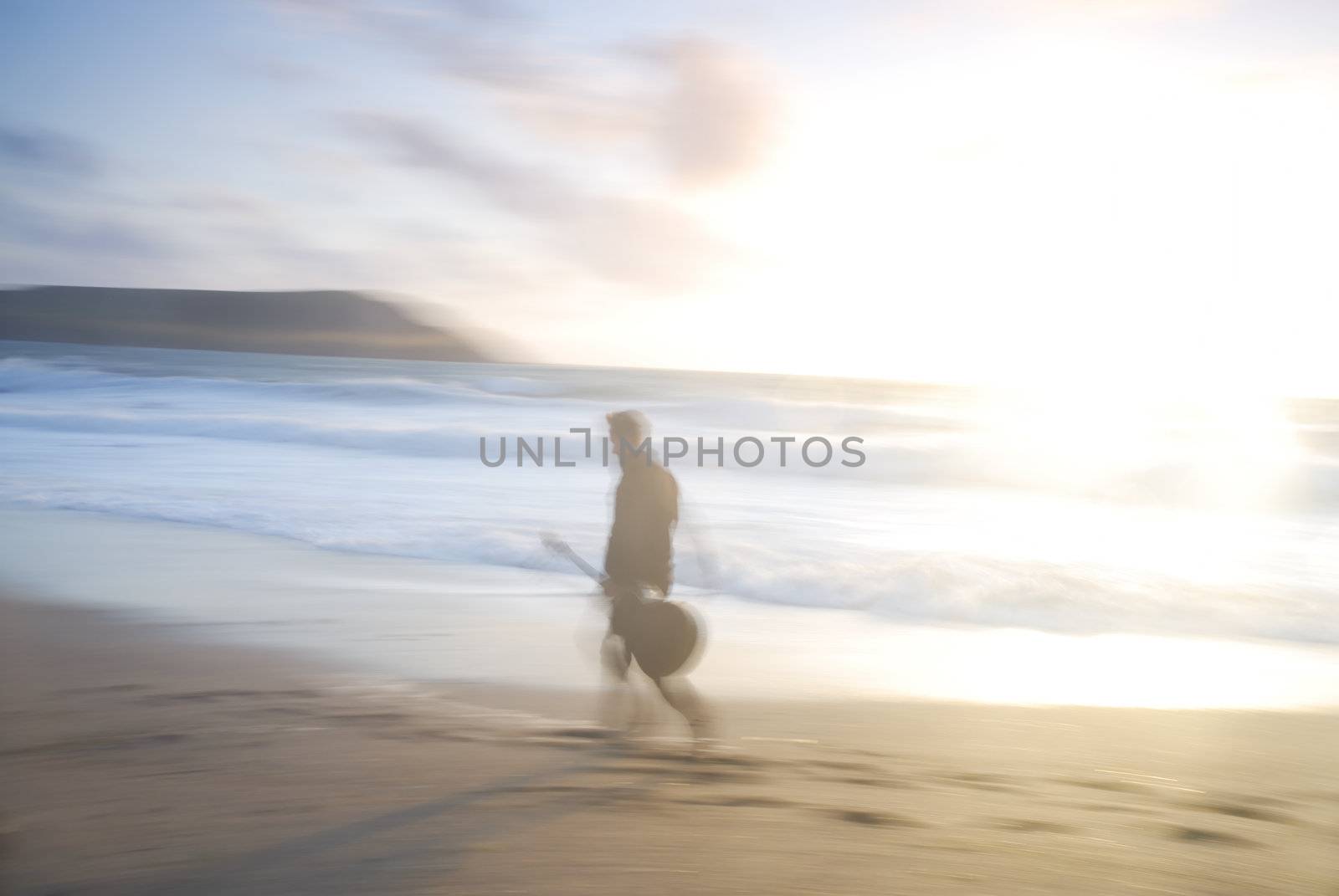 Motion blurred photo of man with guitar, UK.