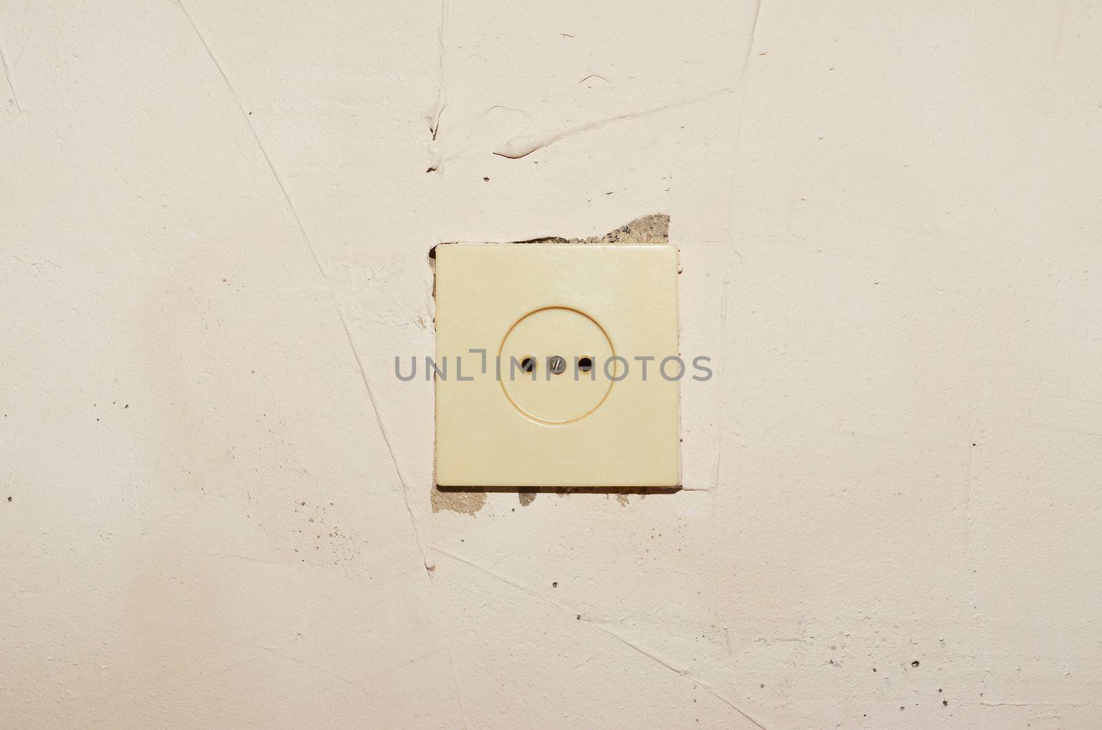 Plastic socket mounted in a concrete wall putty