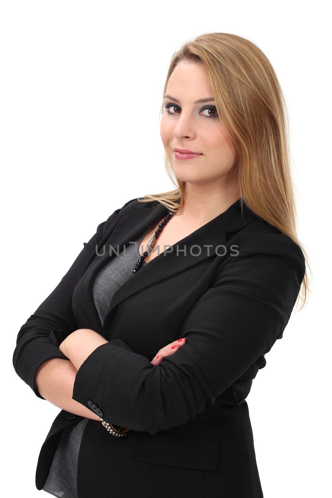 Photo of a young blond business woman standing with her arms crossed.
