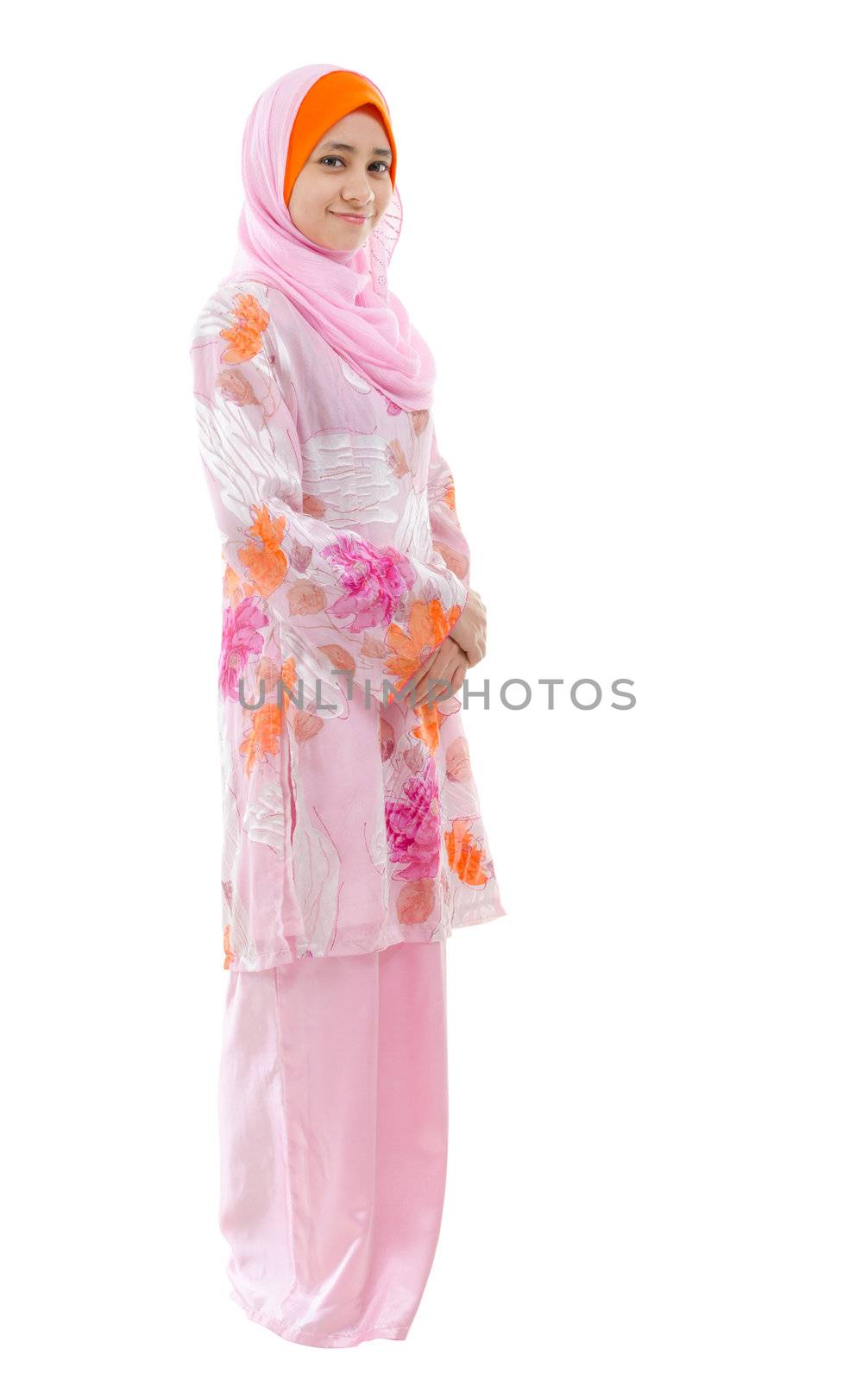 Portrait of full body Southeast Asian Muslim girl smiling, standing on white background