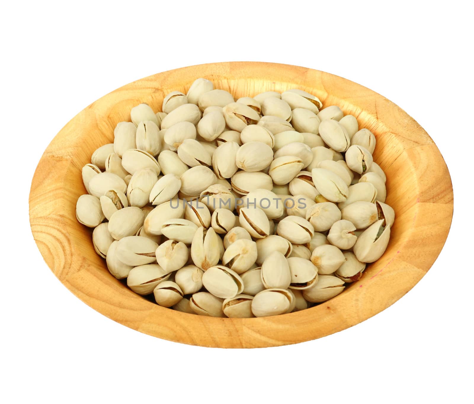 Pistachio nuts in a wooden bowl on white background 