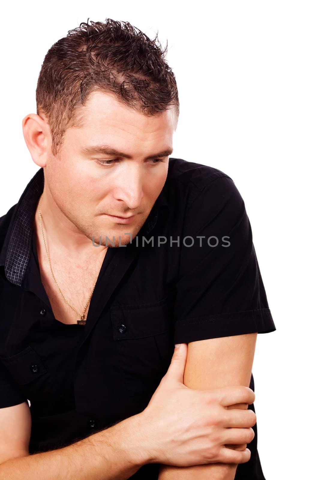A young man in a black shirt, deep in thought on a white background
