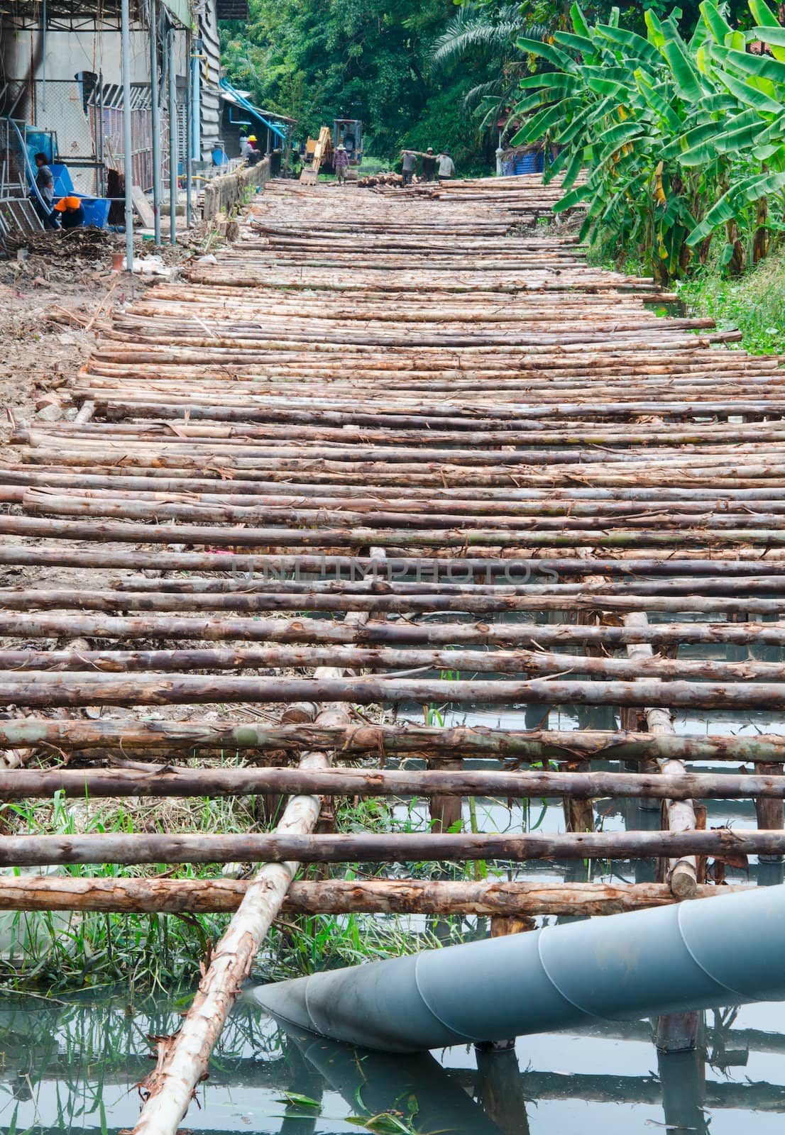 wooden bridge under construction in Thailand
