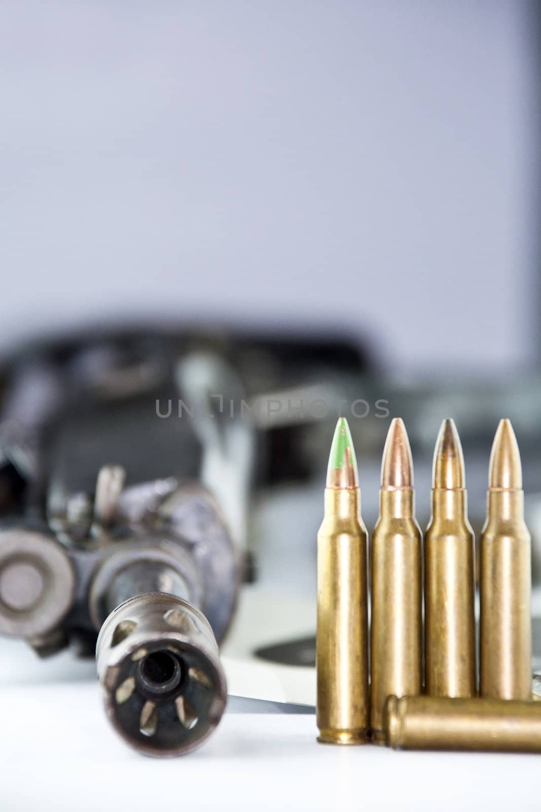 Close up of rifle and bullets on white background by Yuri2012