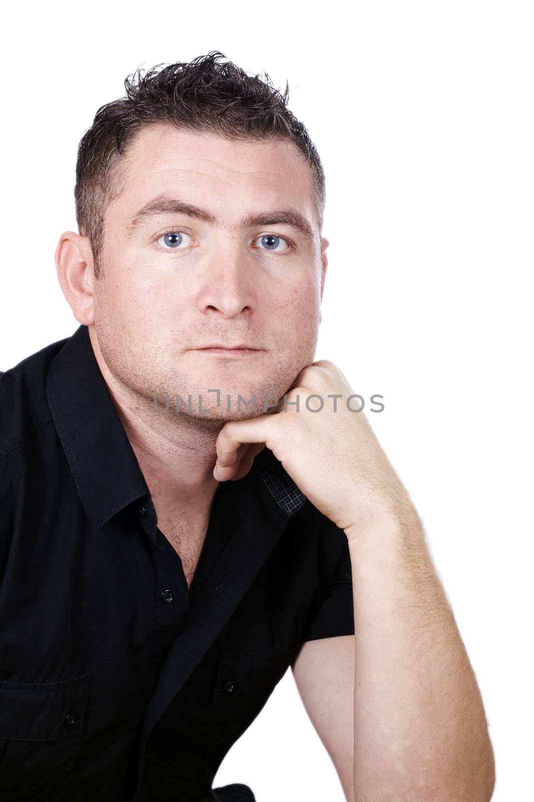 Young man in a black shirt, deep in thought on a white background