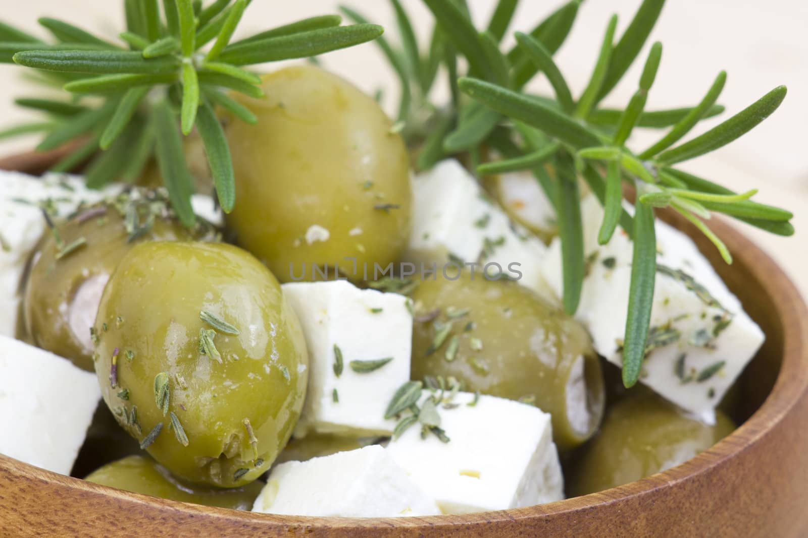 feta cheese and olives with herbs in olive oil