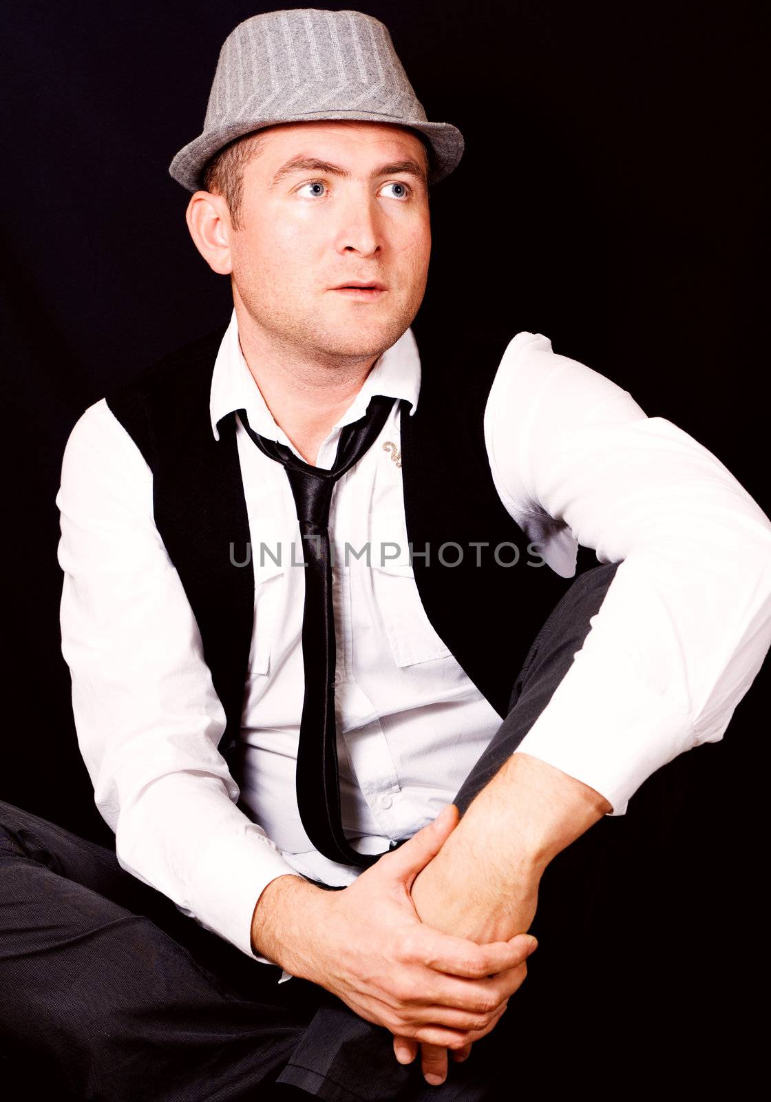 Portrait of young beautiful man in the hat
