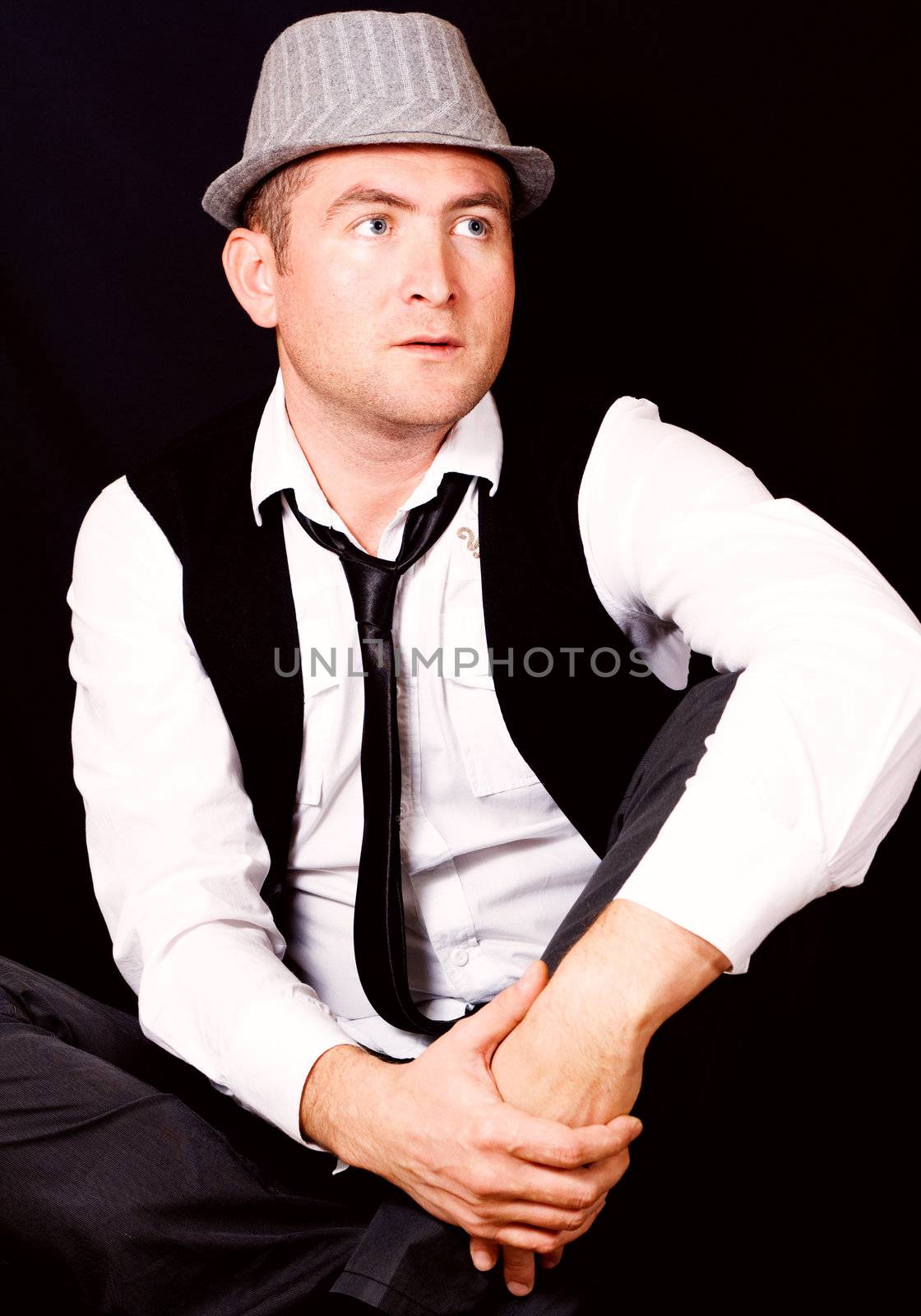 Portrait of young beautiful man in the hat
