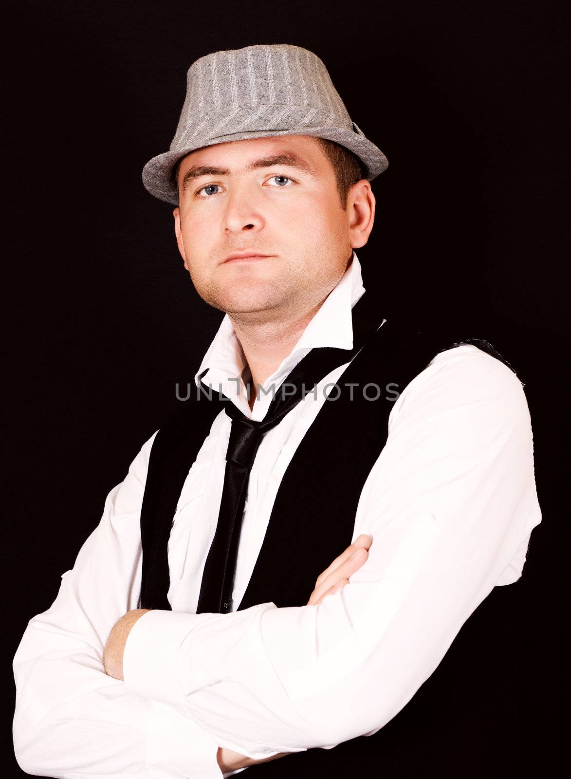 Portrait of young beautiful man in the hat