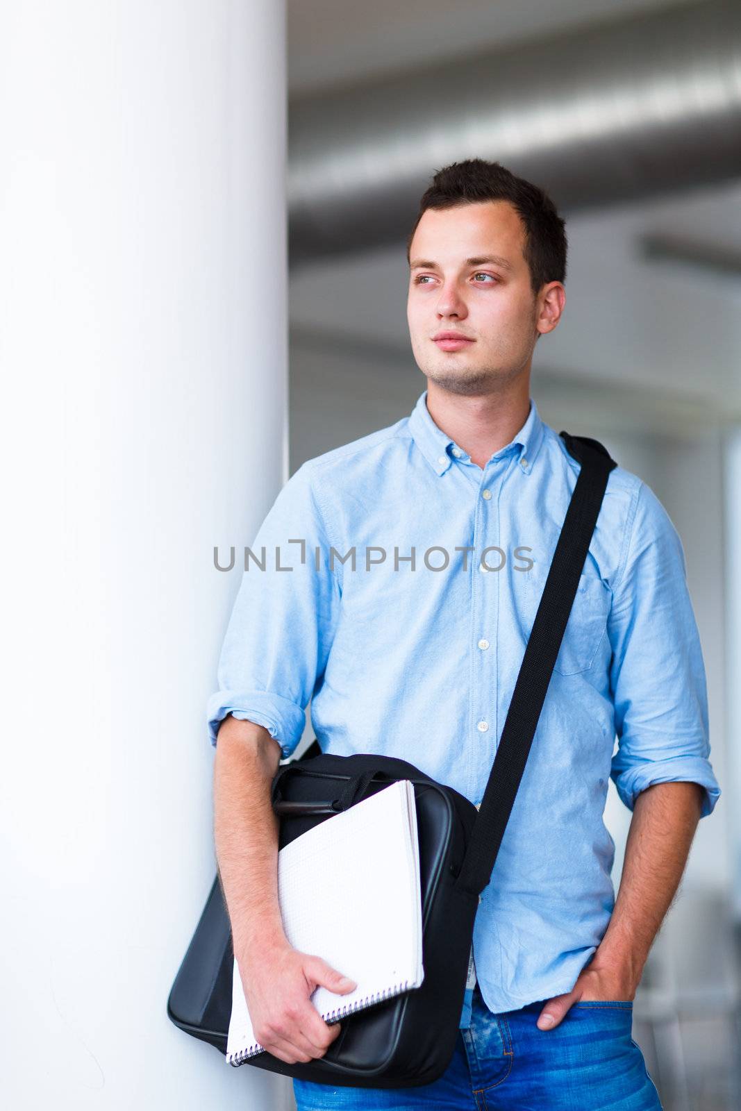 Handsome college student on campus (shallow DOF; color toned image)