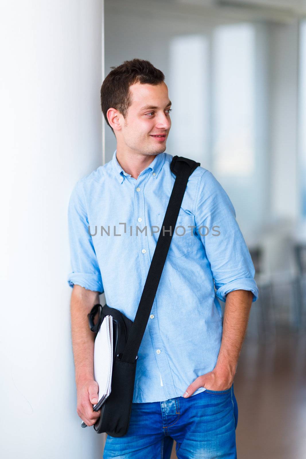 Handsome college student on campus (shallow DOF; color toned image)