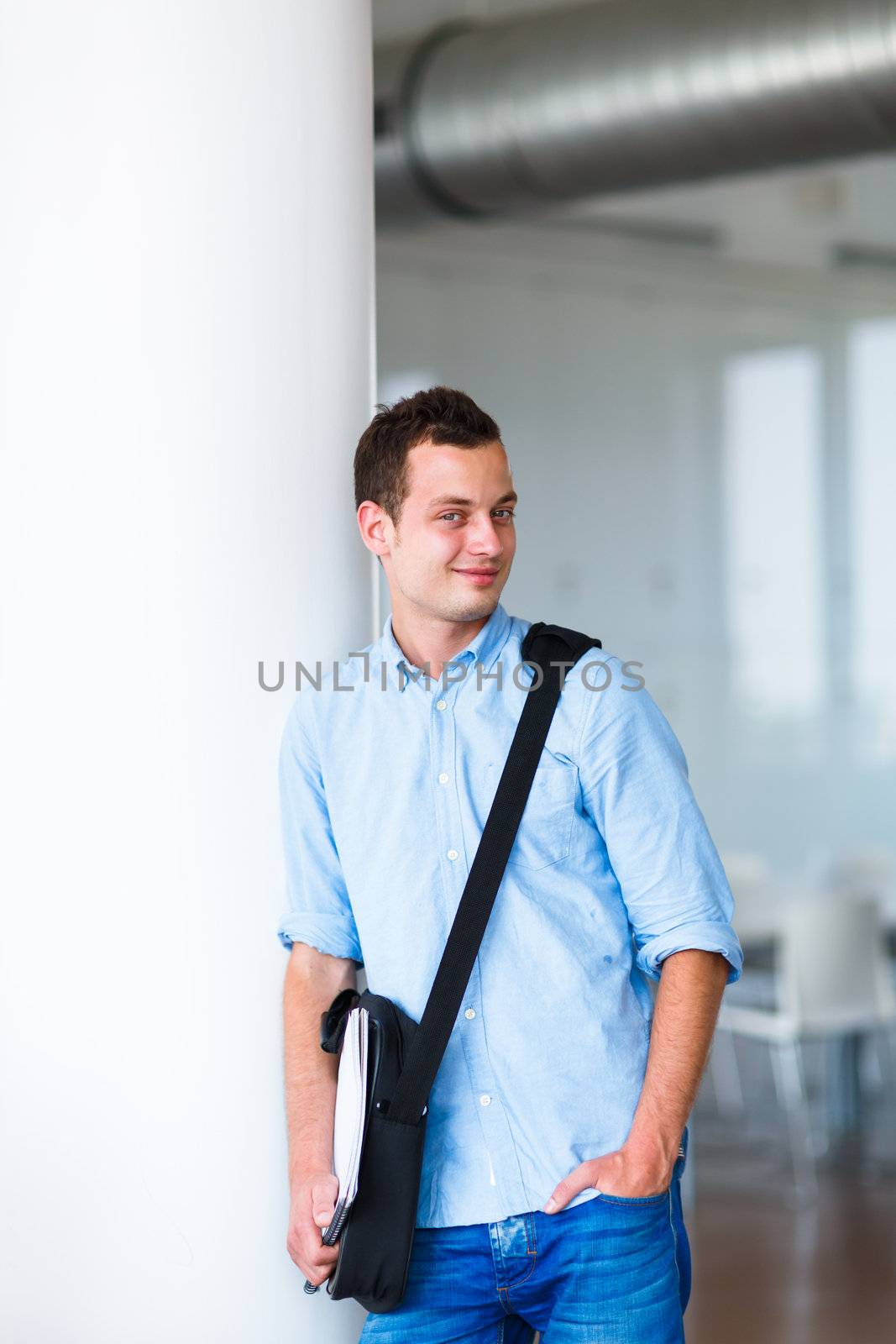 Handsome college student on campus (shallow DOF; color toned image)