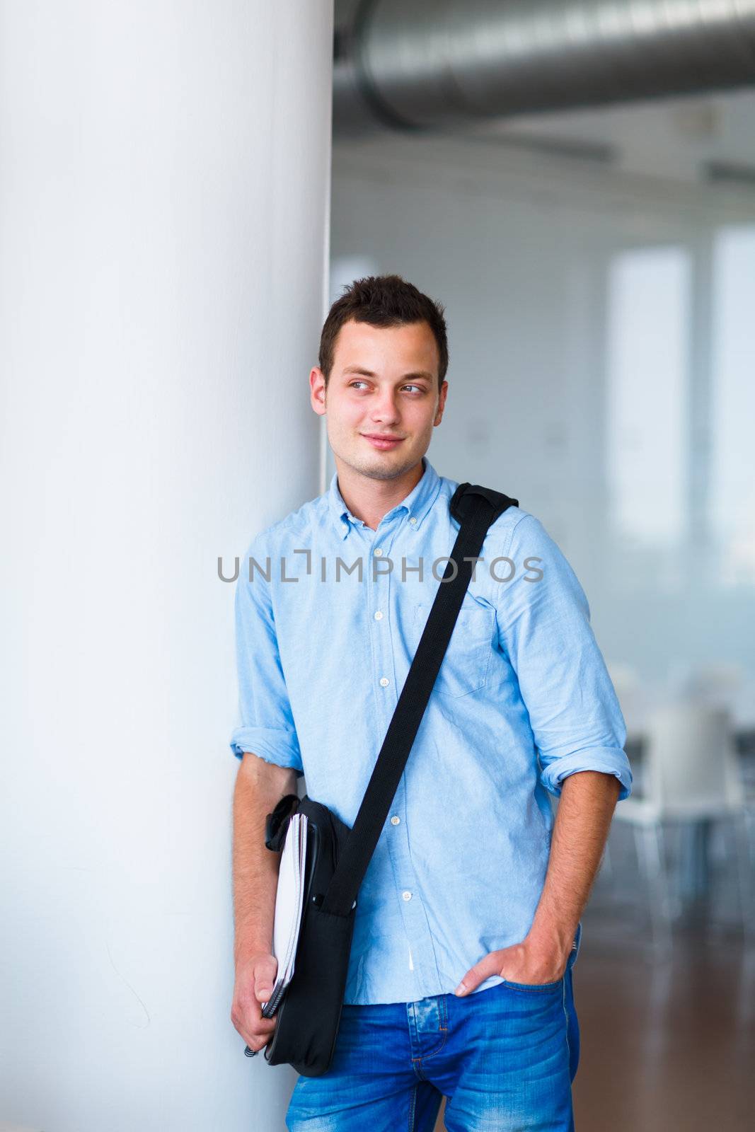 Handsome college student on campus (shallow DOF; color toned image)