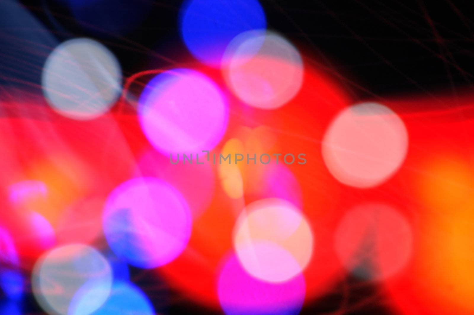 Light abstraction blurry colorful dots and flashing shapes background pattern.