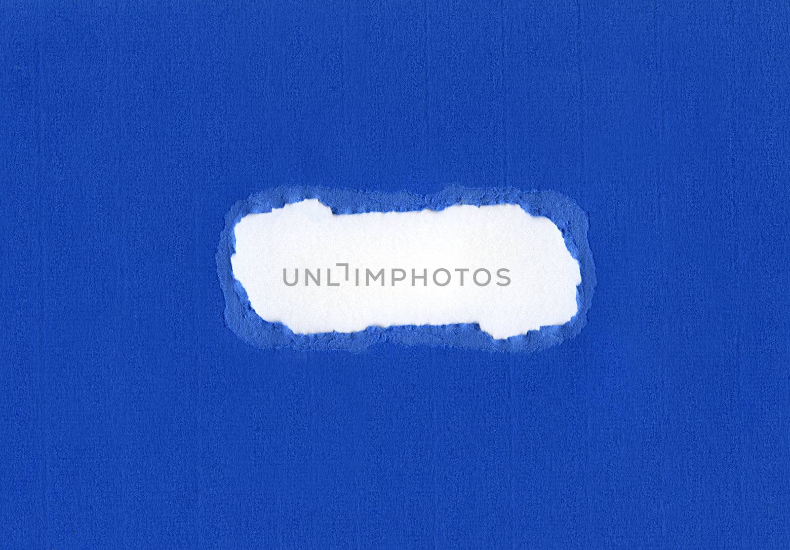 Ripped hole in blue card.  Ideal for using as a background/texture or for a heading.