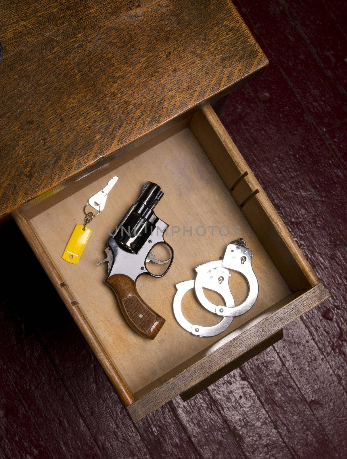 38 Revolver in Desk Drawer with Handcuffs  by ChrisBoswell