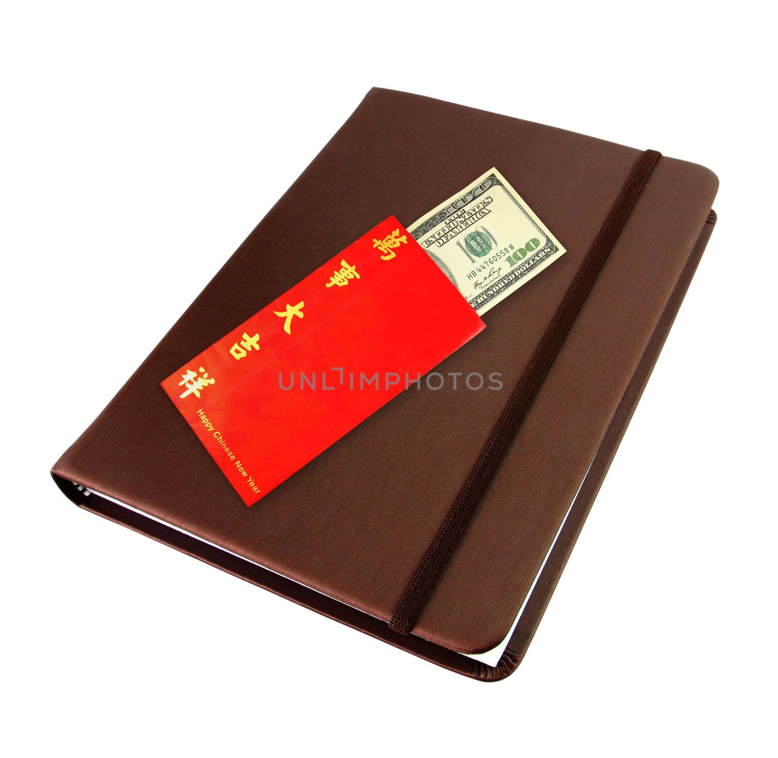 Money dollar cash banknote in red envelope on brown notebook isolated on white for chinese new year