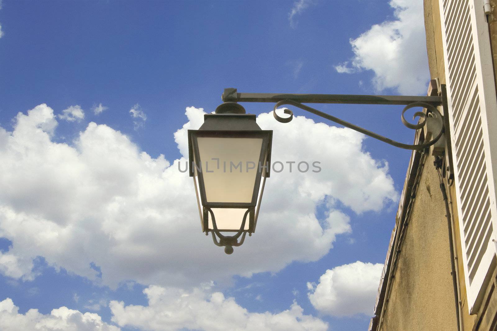 Lantern on the facade of old French house