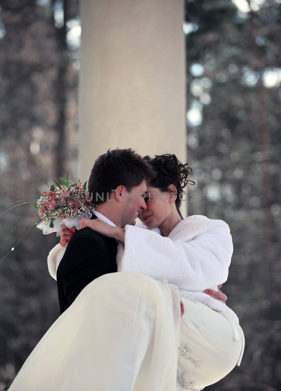 The bride and the groom in park