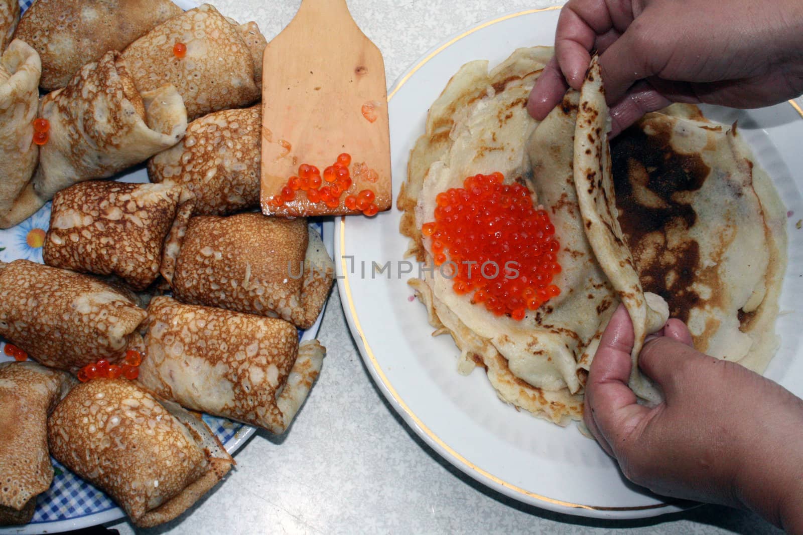 Russian pancakes with caviar of fish Salmo salar