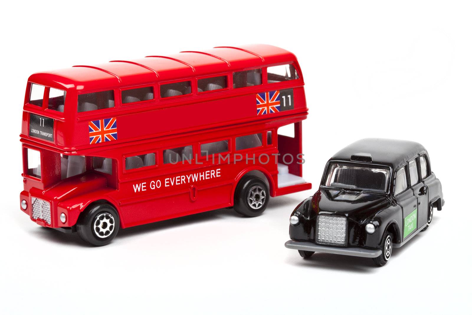 A red London Bus and black London Taxi over a white background.