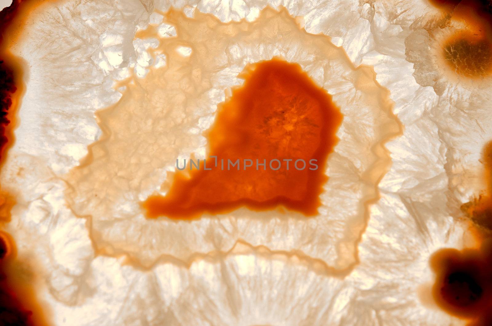 Close up of a thinly sliced backlit natural agate