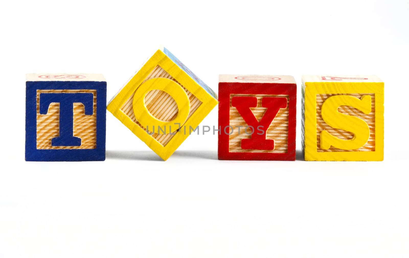 The word 'TOYS' spelt out using letter blocks.