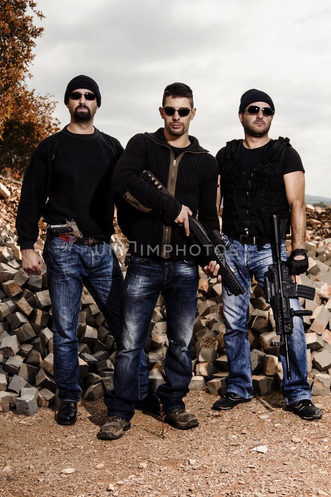 View of a group of gang members with guns.